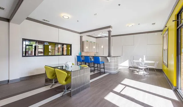 a living room with furniture and a table