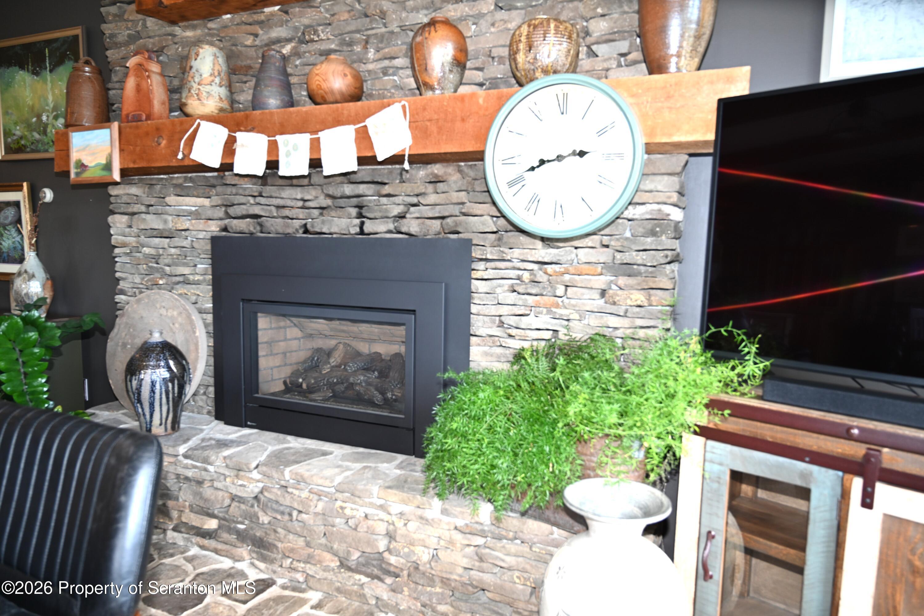 512-318 Johnson Pond Road Montrose, PA 18801 - Photo 20 of 89 a front view of a fireplace with garden