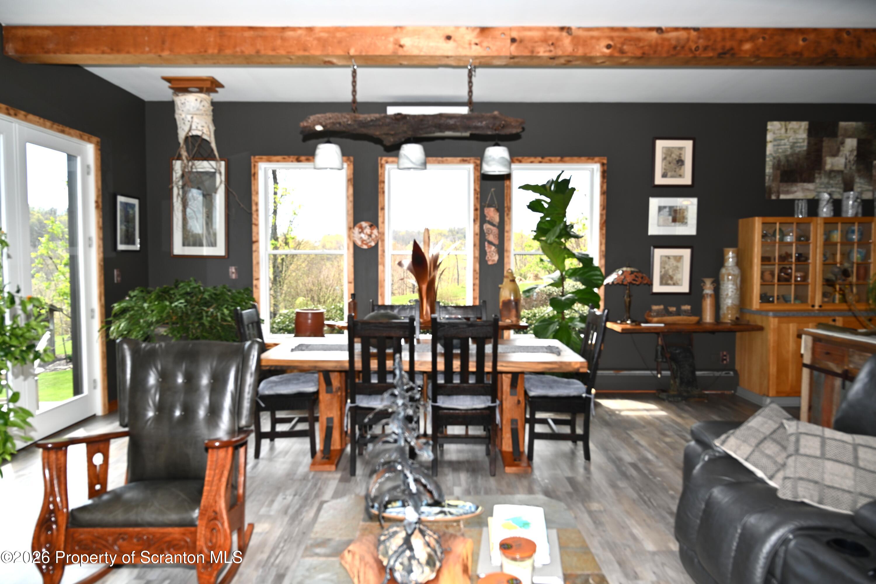 512-318 Johnson Pond Road Montrose, PA 18801 - Photo 22 of 89 a view of a dining room with furniture window and outside view