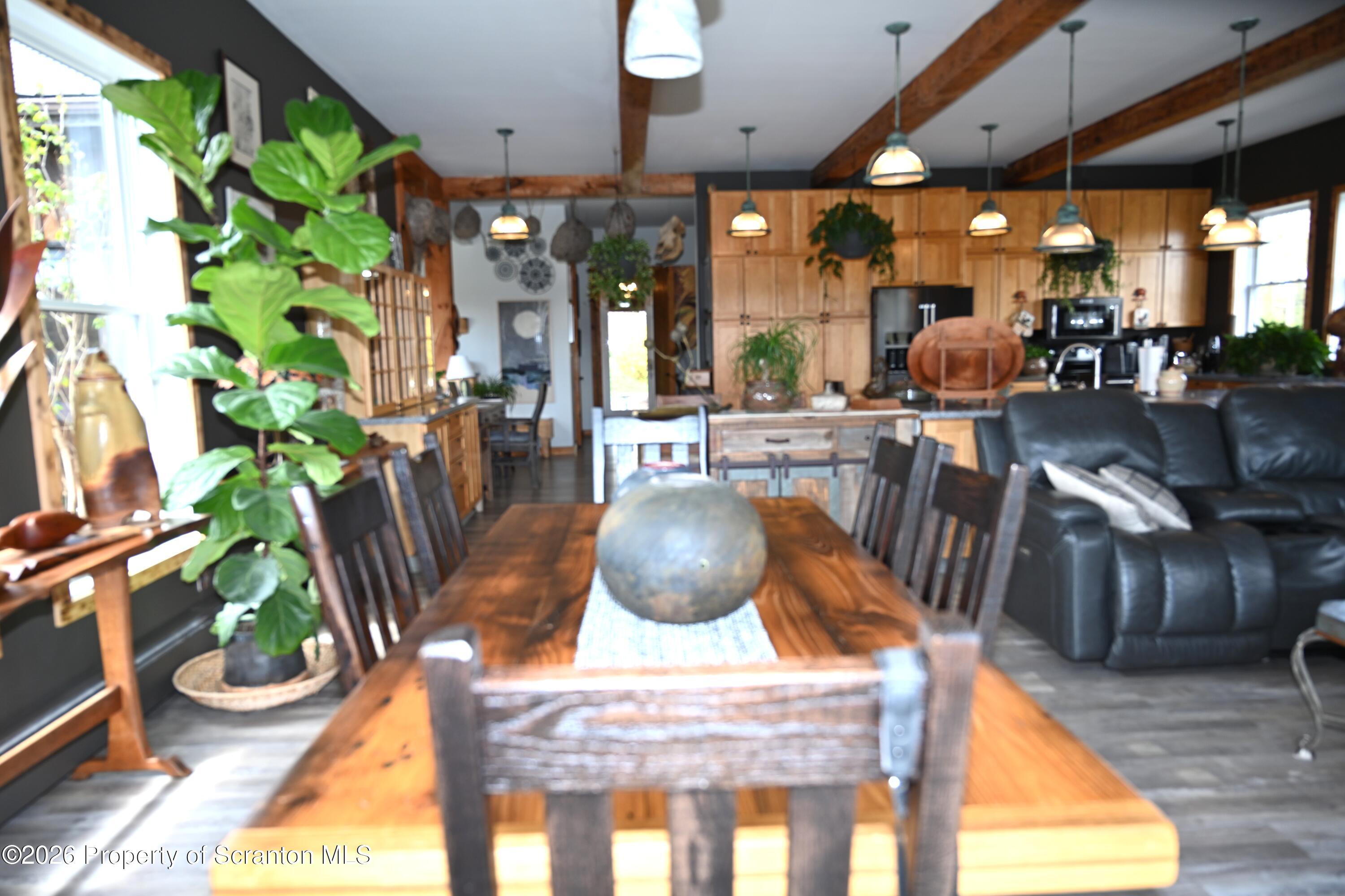 512-318 Johnson Pond Road Montrose, PA 18801 - Photo 24 of 89 a dining room with furniture and a potted plant