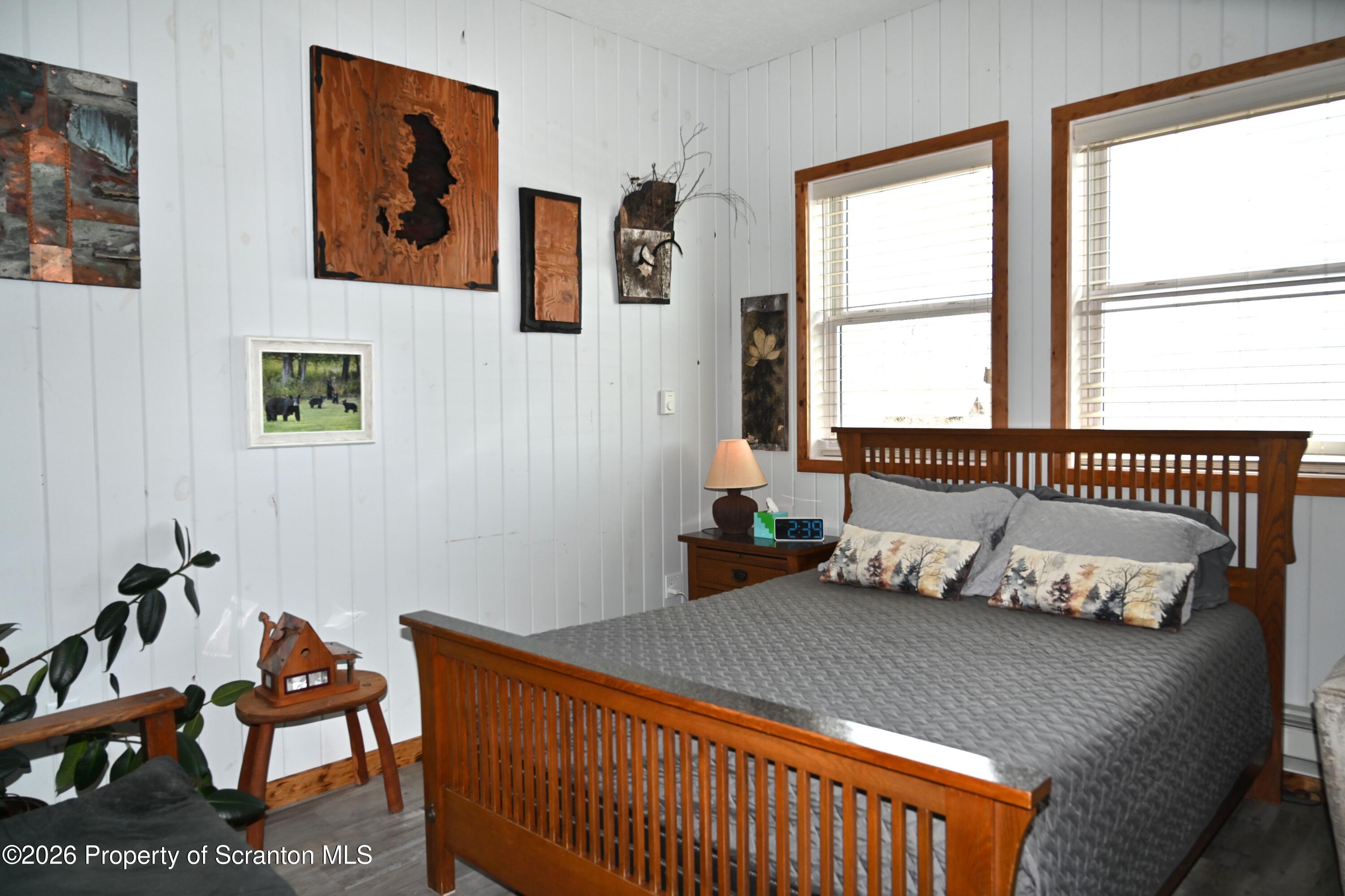512-318 Johnson Pond Road Montrose, PA 18801 - Photo 25 of 89 a bedroom with a bed and wooden floor