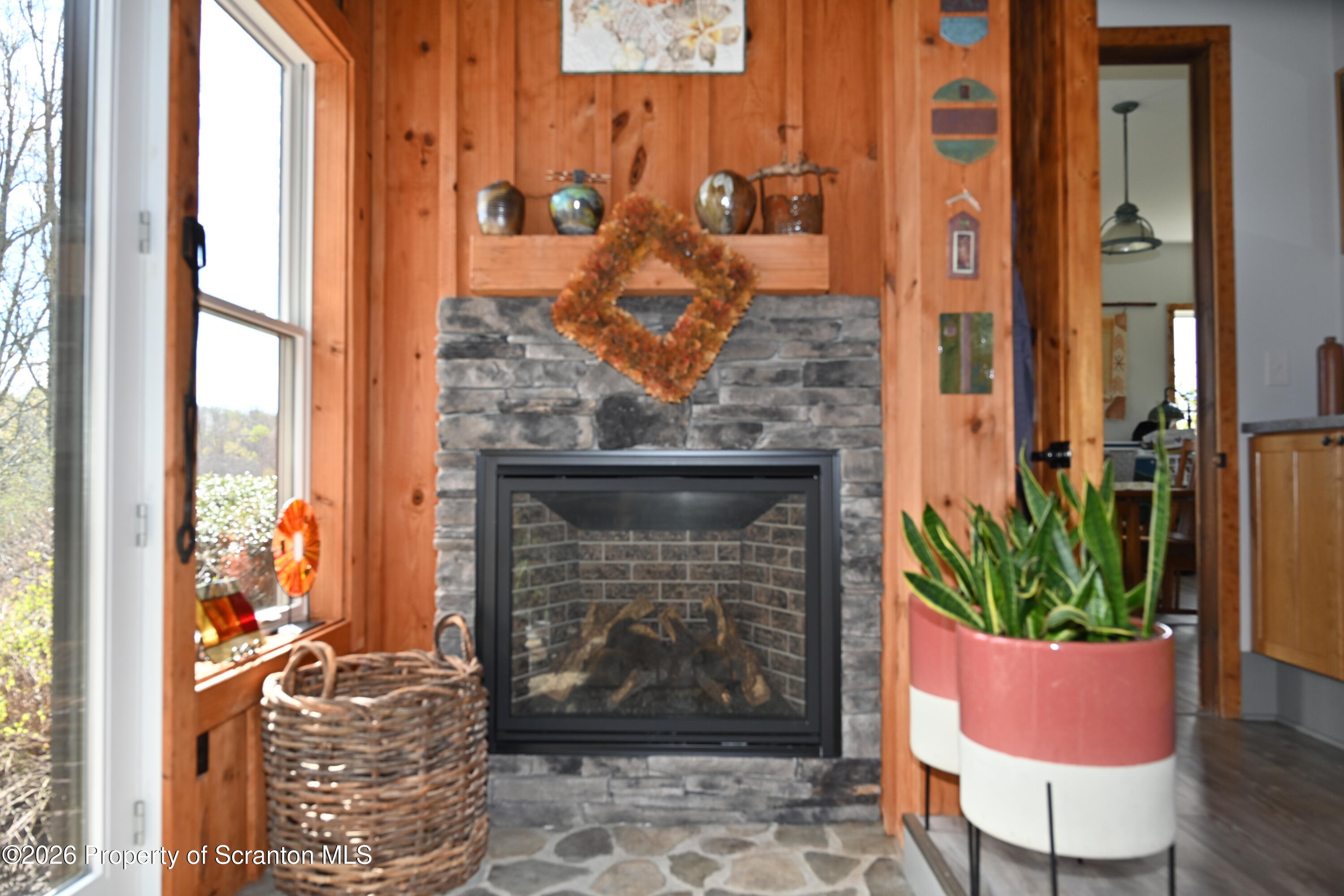 512-318 Johnson Pond Road Montrose, PA 18801 - Photo 27 of 89 a room with furniture and a fireplace