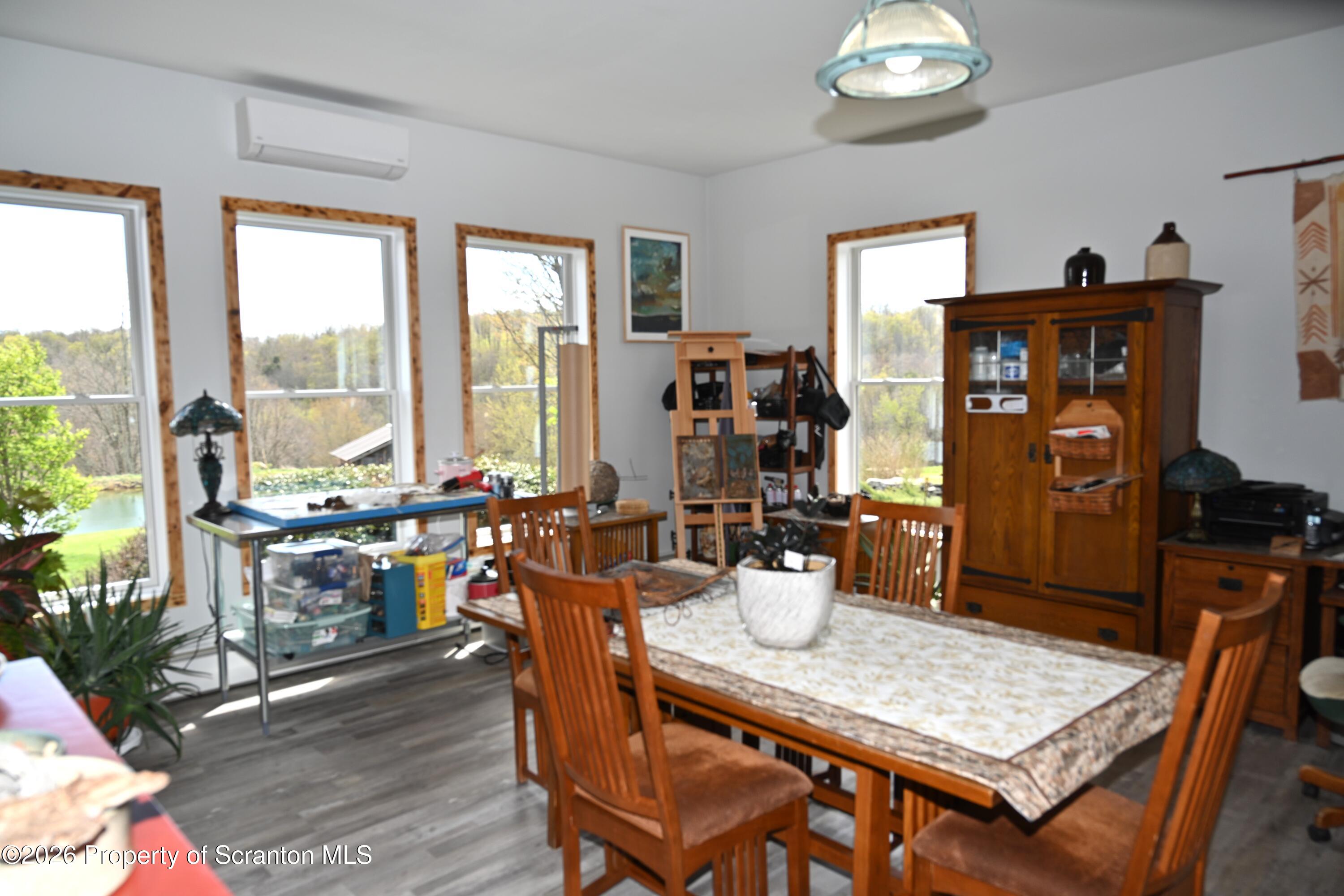 512-318 Johnson Pond Road Montrose, PA 18801 - Photo 32 of 89 a view of a dining room with furniture window and outside view