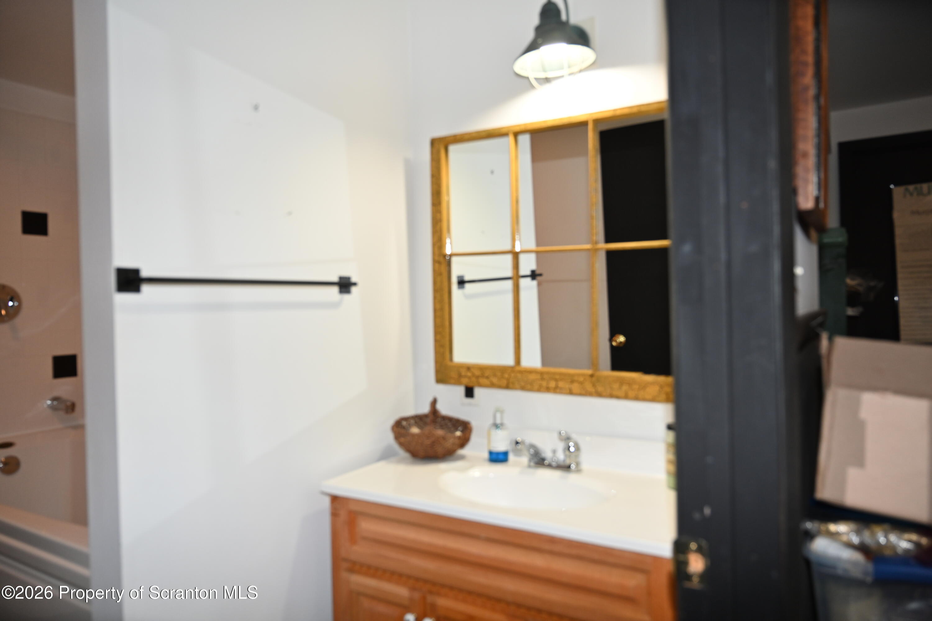 512-318 Johnson Pond Road Montrose, PA 18801 - Photo 43 of 89 a bathroom with a sink and a mirror