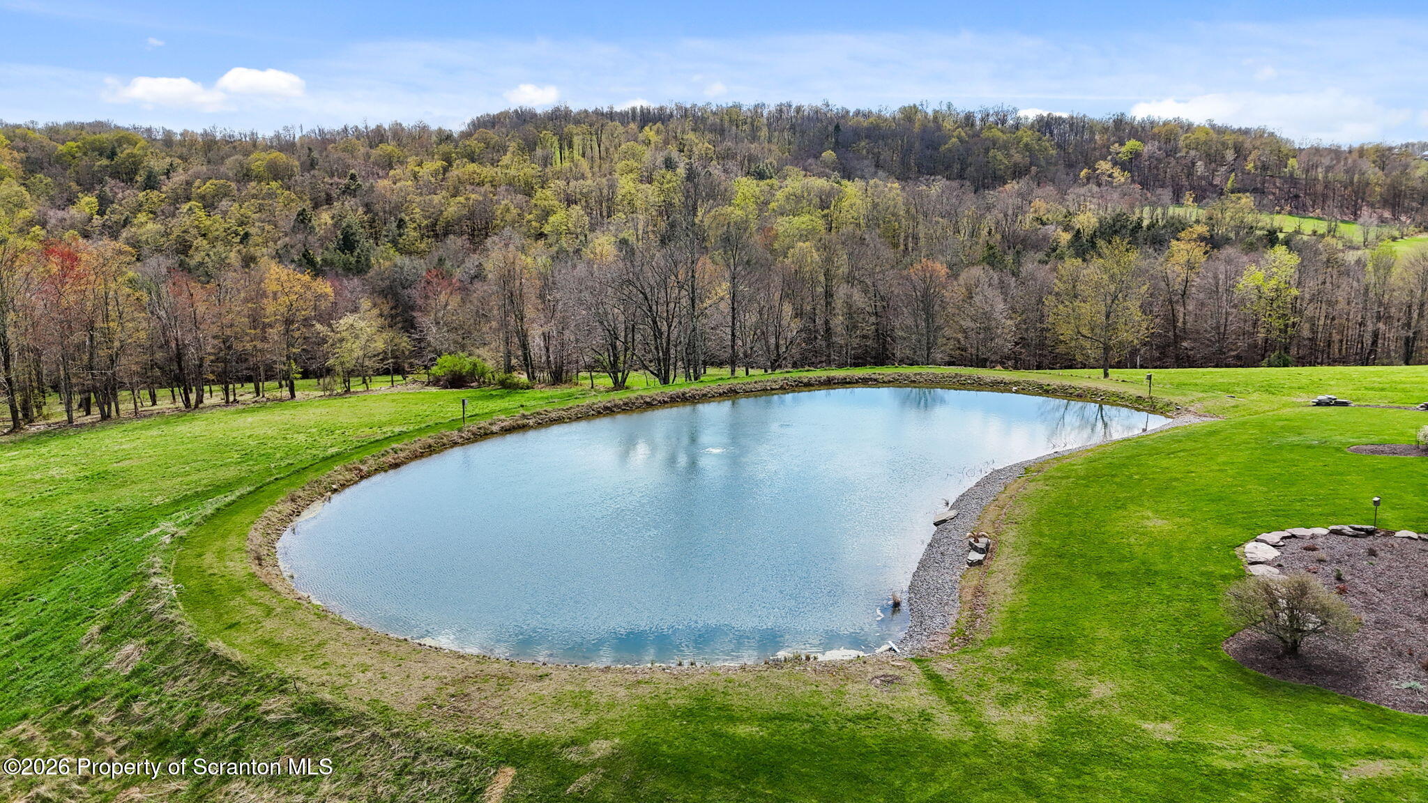 512-318 Johnson Pond Road Montrose, PA 18801 - Photo 5 of 89 a view of a swimming pool with a yard and large tree