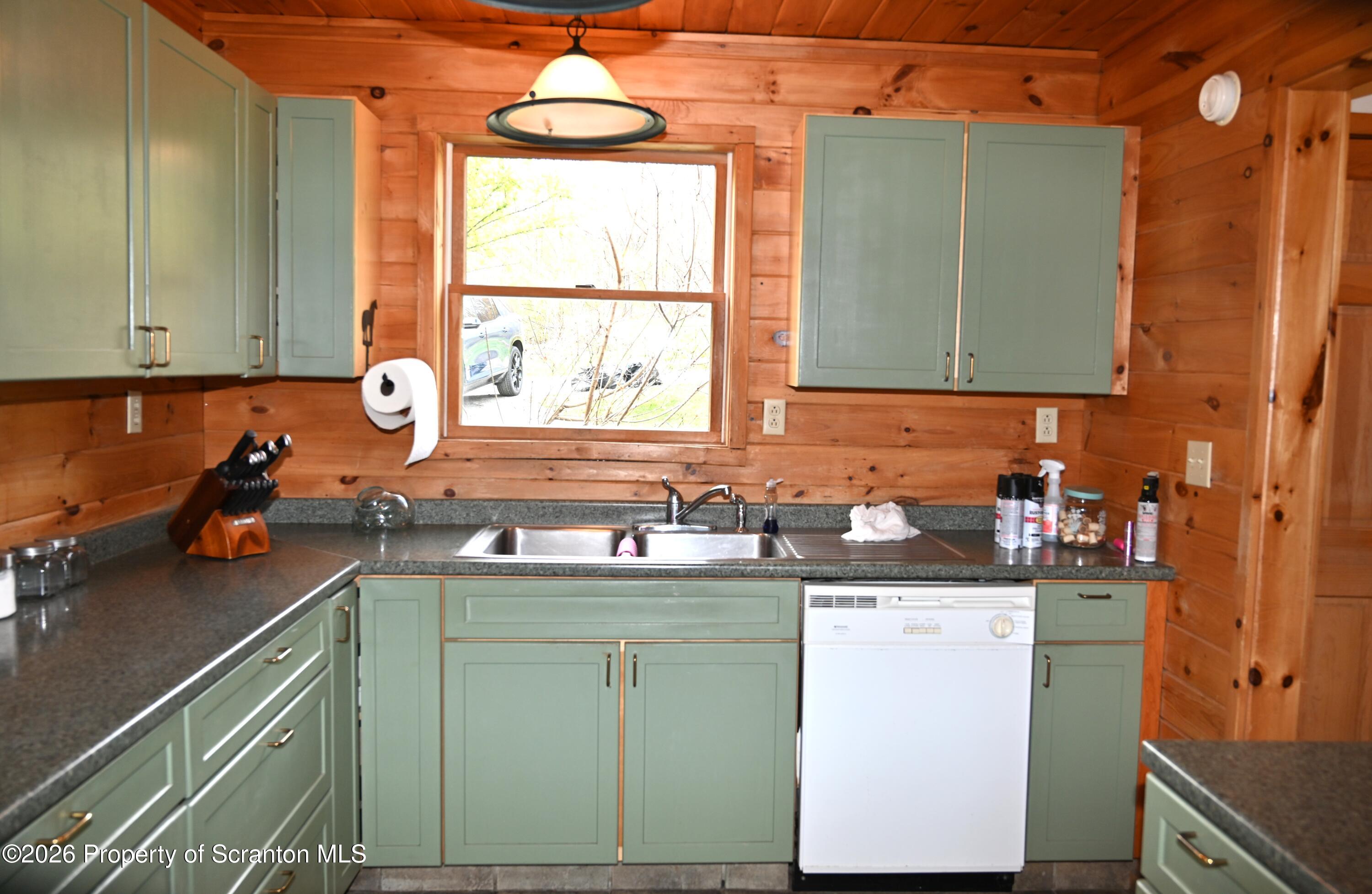 512-318 Johnson Pond Road Montrose, PA 18801 - Photo 65 of 89 a kitchen with a sink cabinets and window