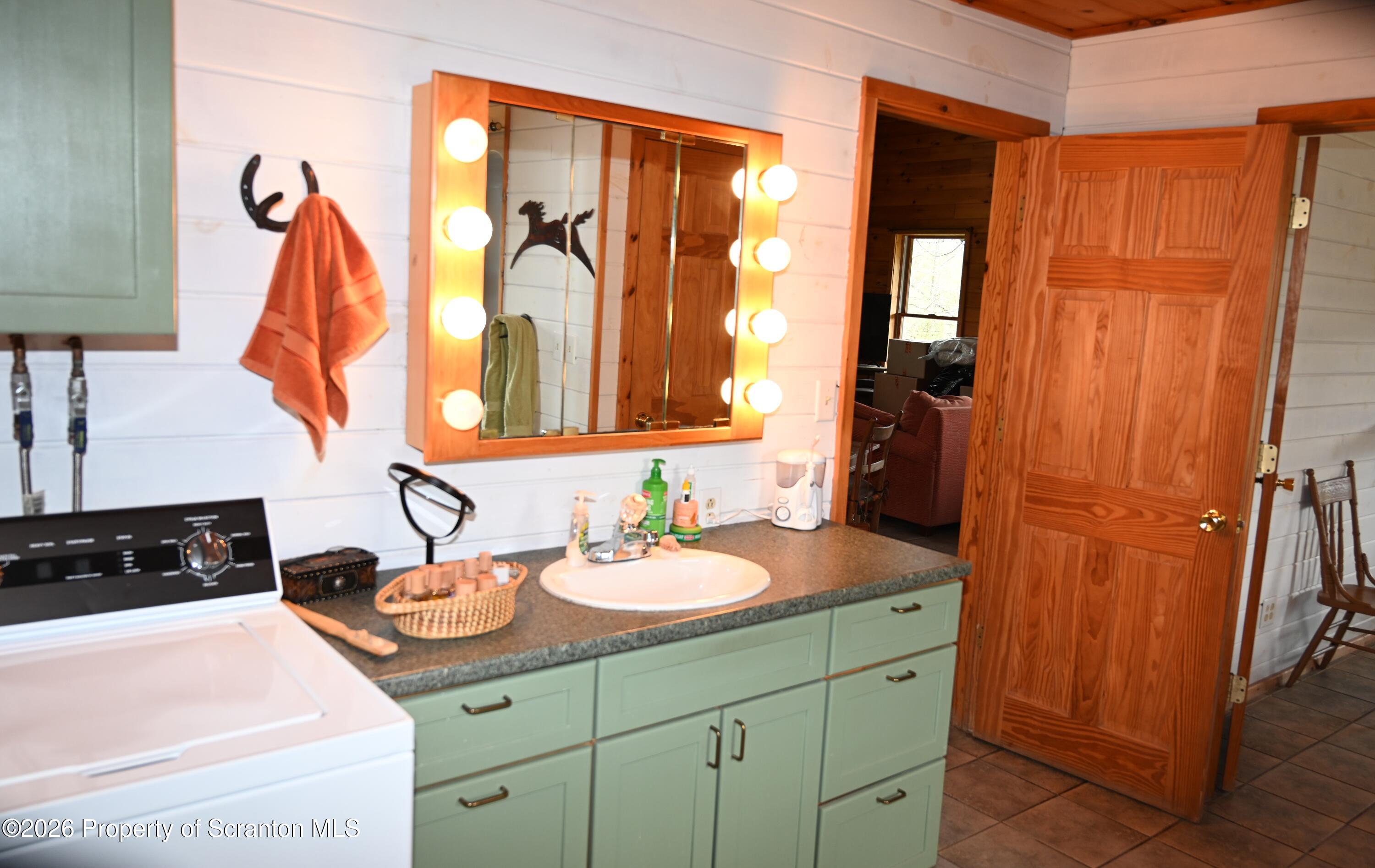 512-318 Johnson Pond Road Montrose, PA 18801 - Photo 73 of 89 a bathroom with a sink and a mirror