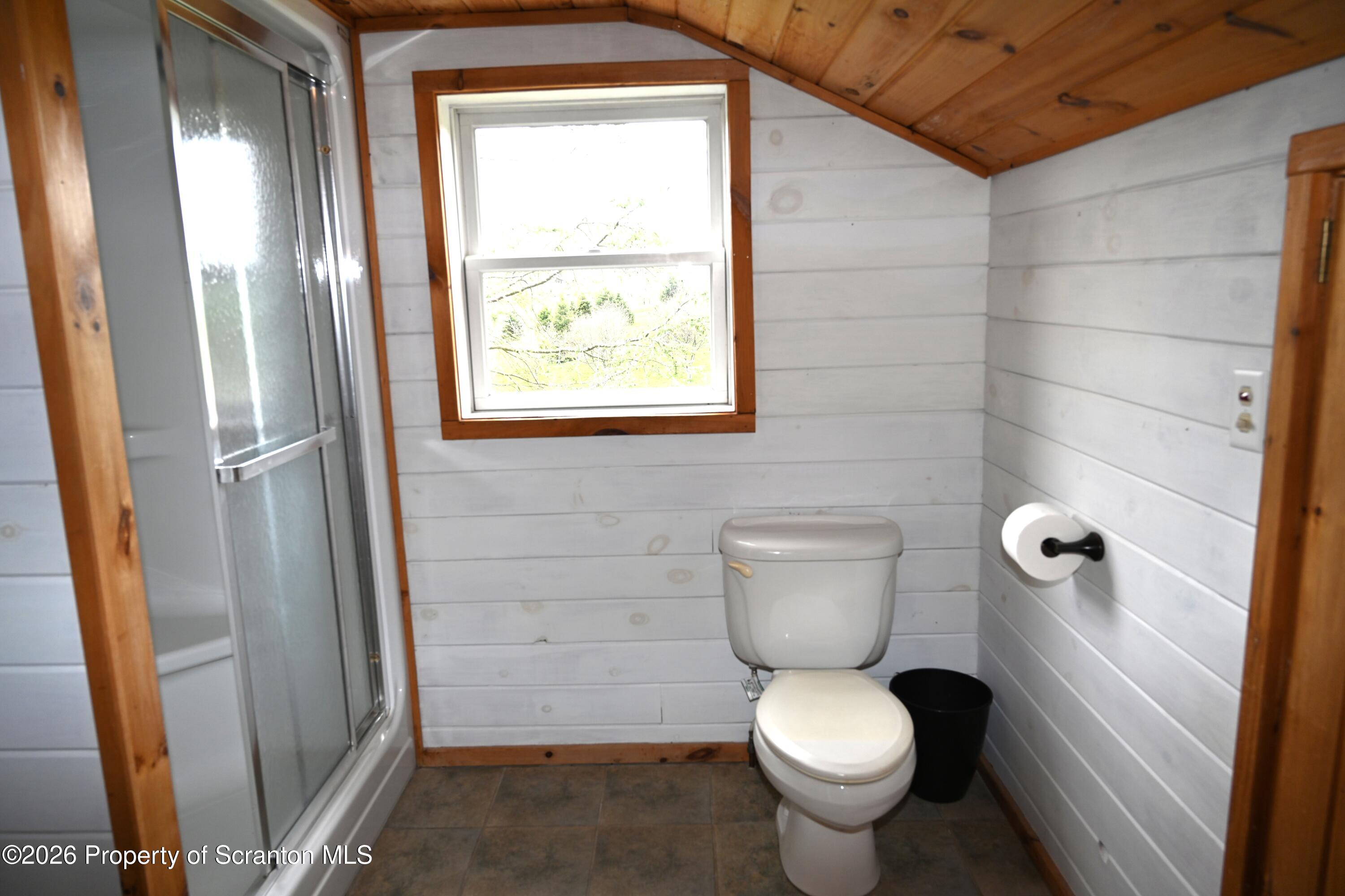 512-318 Johnson Pond Road Montrose, PA 18801 - Photo 81 of 89 a bathroom with a toilet and a shower