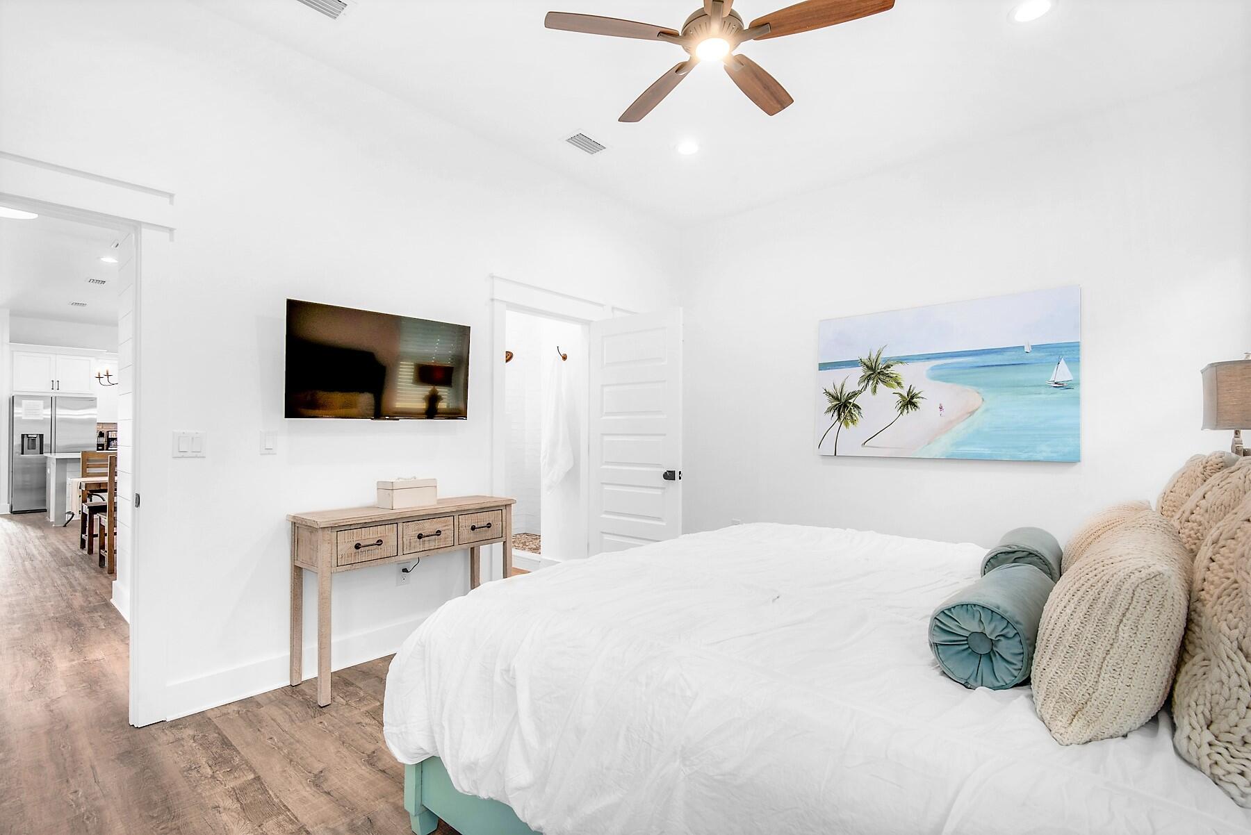 4541 Luke Avenue Destin, FL 32541 - Photo 13 of 49 a bedroom with a bed and a flat screen tv