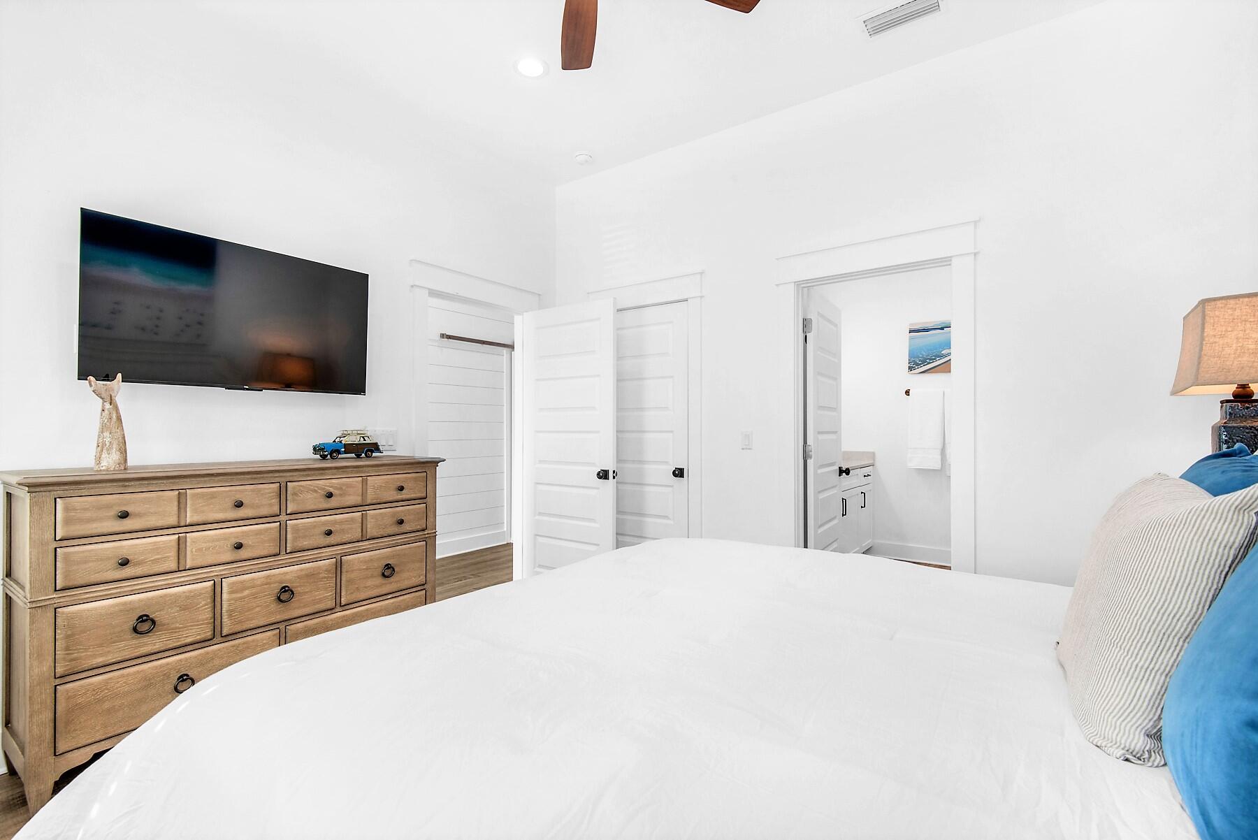 4541 Luke Avenue Destin, FL 32541 - Photo 17 of 49 a bedroom with a bed and a flat screen tv