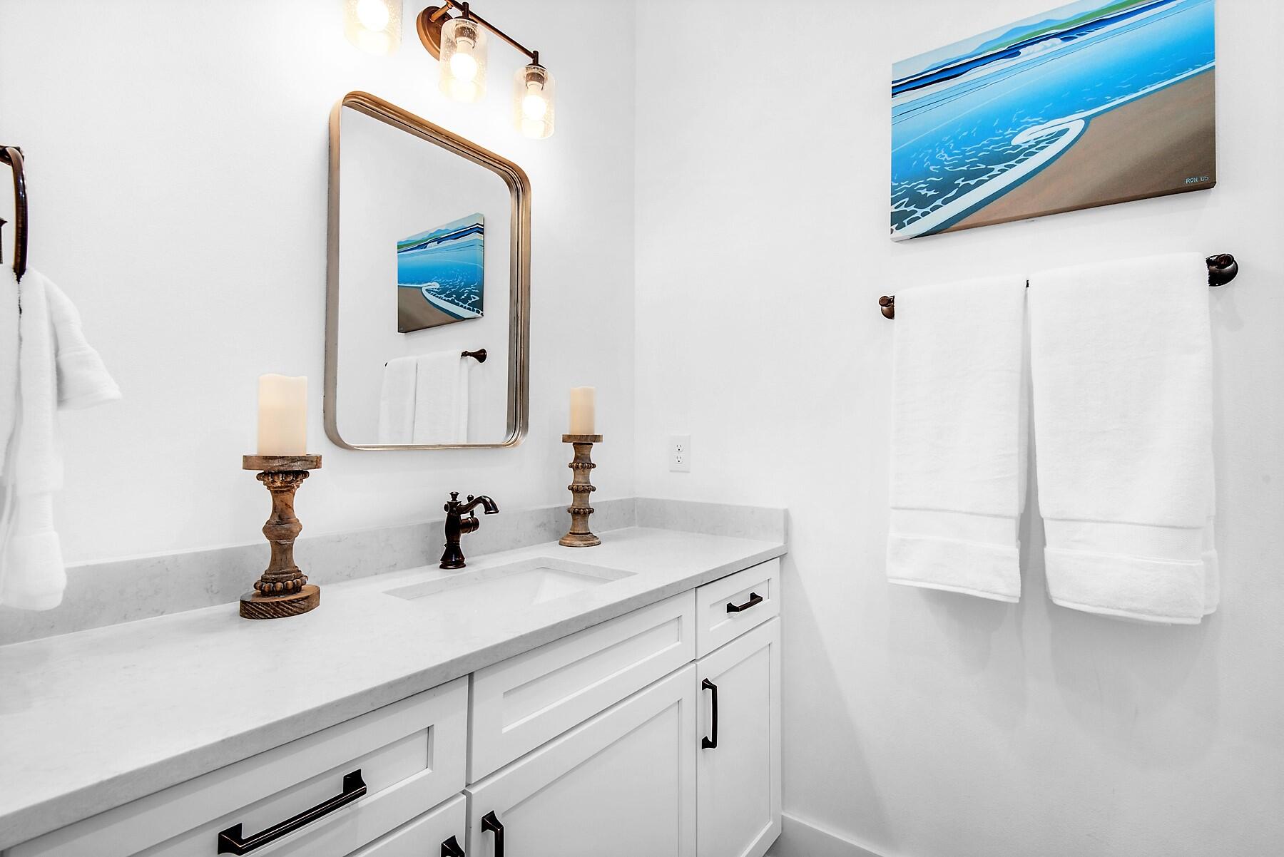 4541 Luke Avenue Destin, FL 32541 - Photo 18 of 49 a bathroom with a sink and a mirror