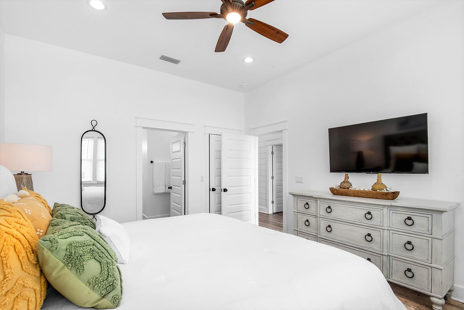 4541 Luke Avenue Destin, FL 32541 - Photo 21 of 49 a bedroom with a bed and a flat screen tv