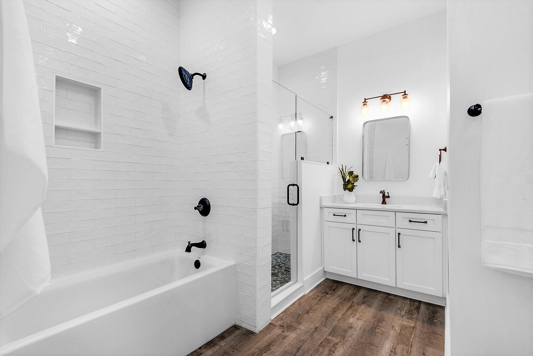 4541 Luke Avenue Destin, FL 32541 - Photo 22 of 49 a spacious bathroom with a bathtub sink and mirror