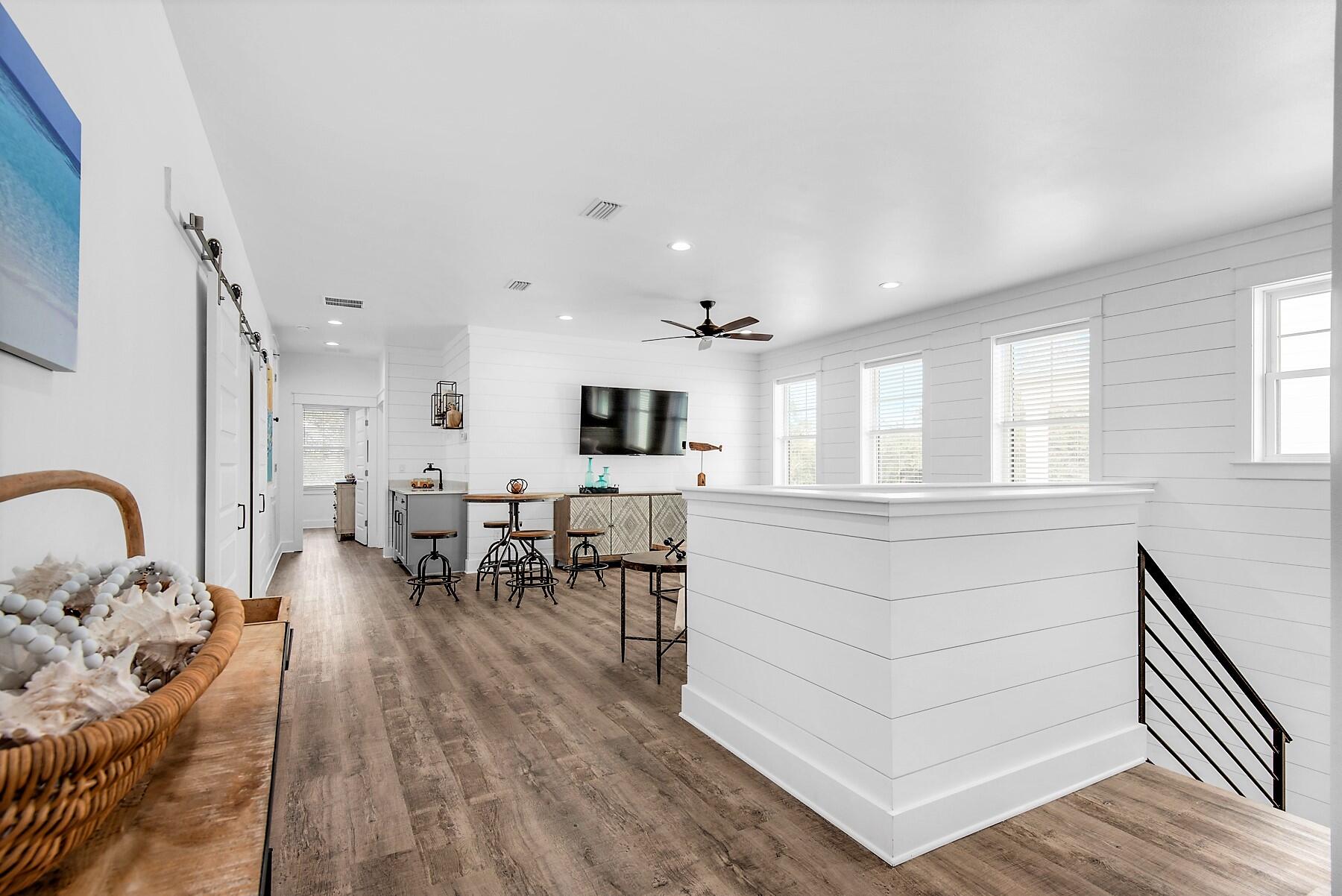 4541 Luke Avenue Destin, FL 32541 - Photo 24 of 49 a living room with furniture a dining table and kitchen view