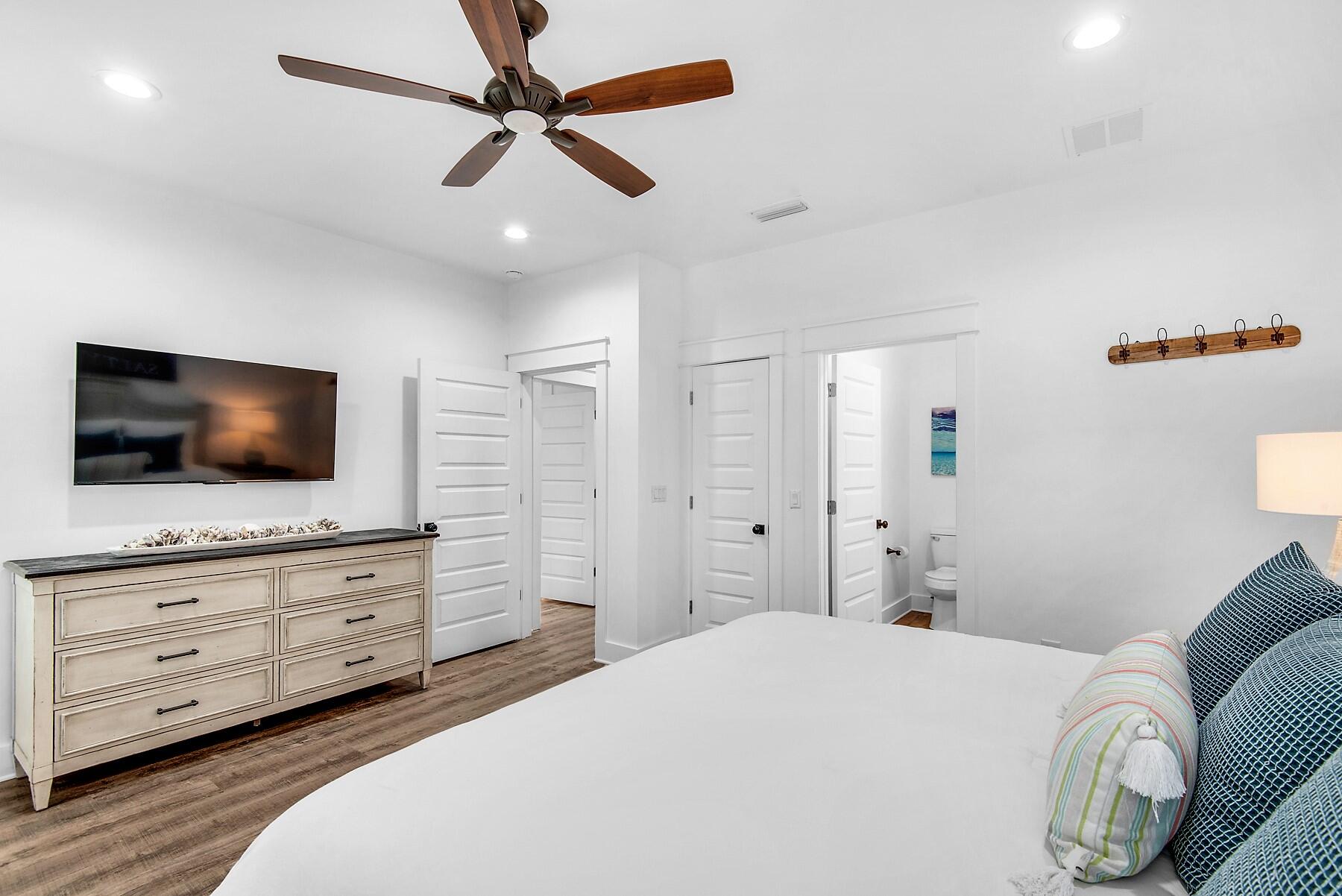 4541 Luke Avenue Destin, FL 32541 - Photo 28 of 49 a bedroom with a bed and a flat screen tv