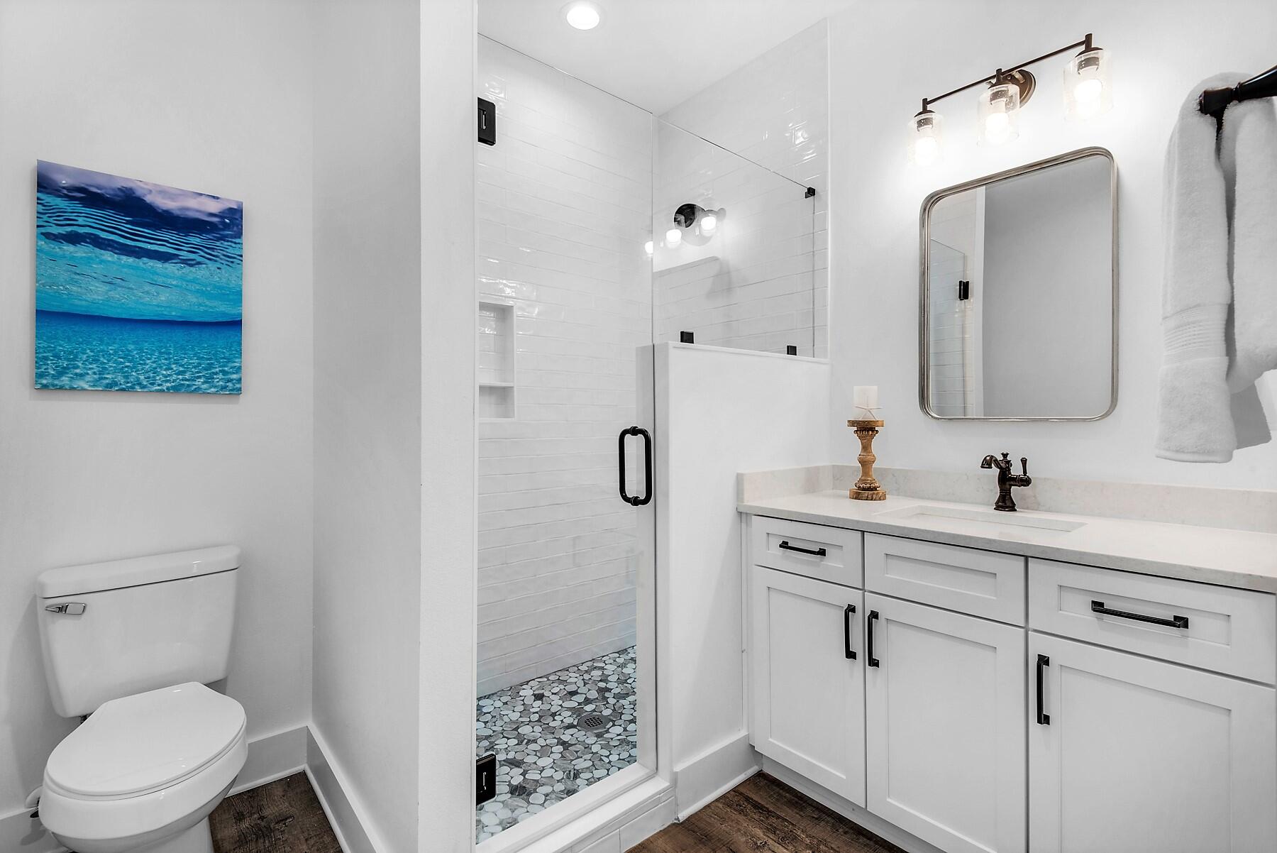 4541 Luke Avenue Destin, FL 32541 - Photo 29 of 49 a bathroom with a toilet sink and shower