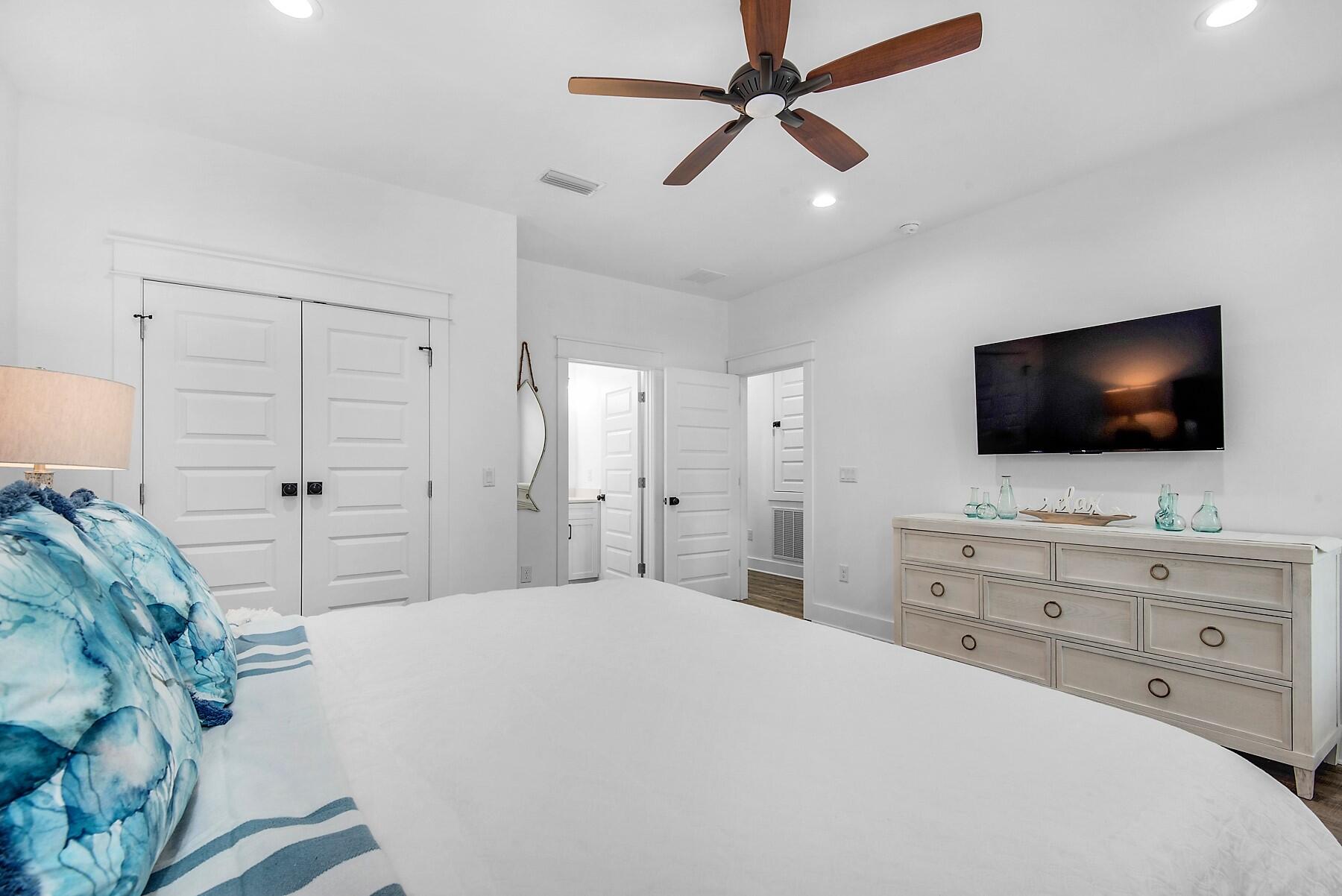 4541 Luke Avenue Destin, FL 32541 - Photo 31 of 49 a bedroom with a large bed and a flat screen tv