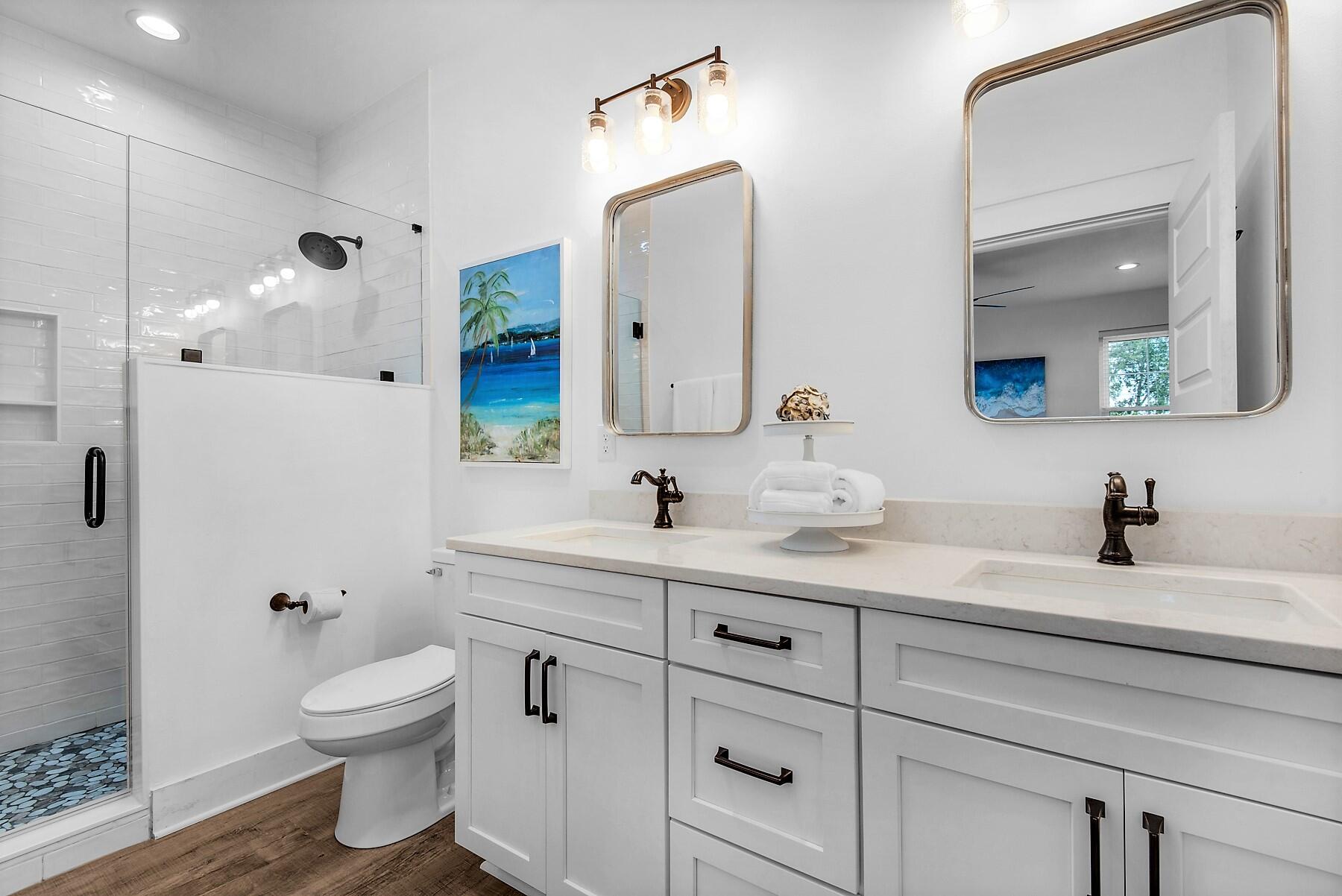4541 Luke Avenue Destin, FL 32541 - Photo 32 of 49 a bathroom with a toilet sink and mirror