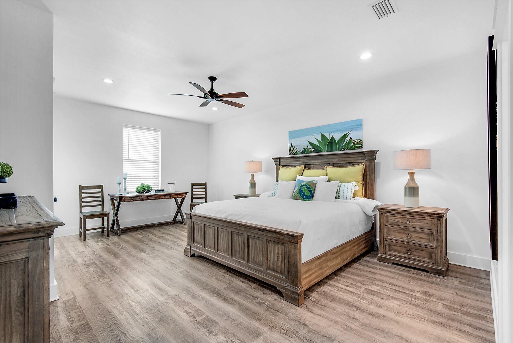 4541 Luke Avenue Destin, FL 32541 - Photo 33 of 49 a bedroom with a bed and a table