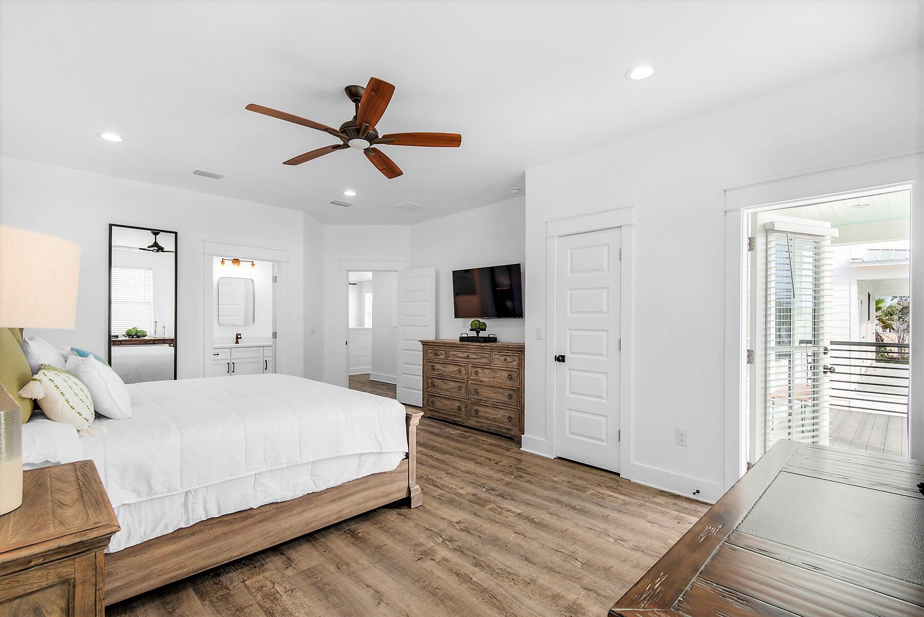 4541 Luke Avenue Destin, FL 32541 - Photo 34 of 49 a bedroom with a bed and a flat screen tv