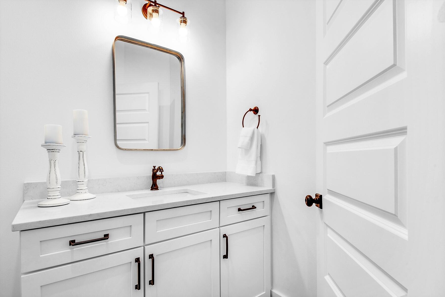 4541 Luke Avenue Destin, FL 32541 - Photo 35 of 49 a bathroom with a sink vanity and mirror