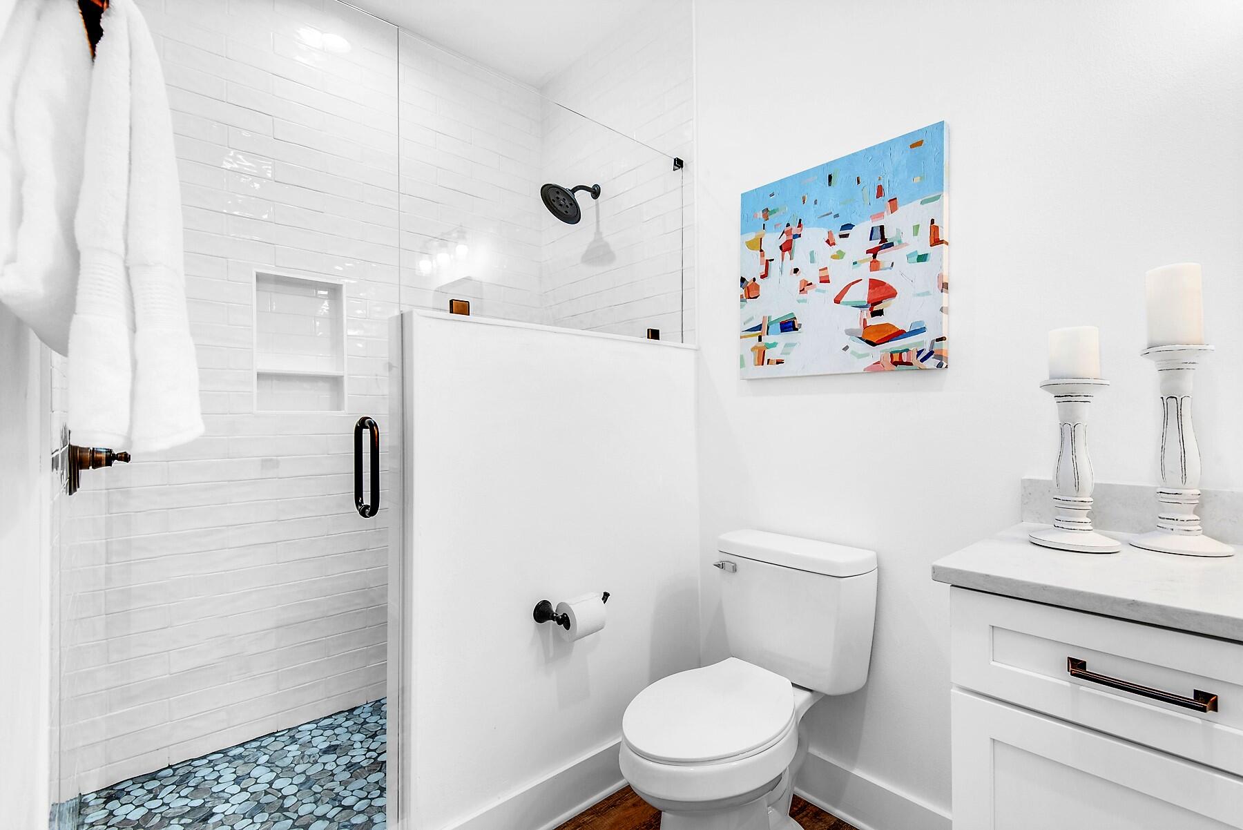 4541 Luke Avenue Destin, FL 32541 - Photo 36 of 49 a white toilet sitting next to a bathroom sink