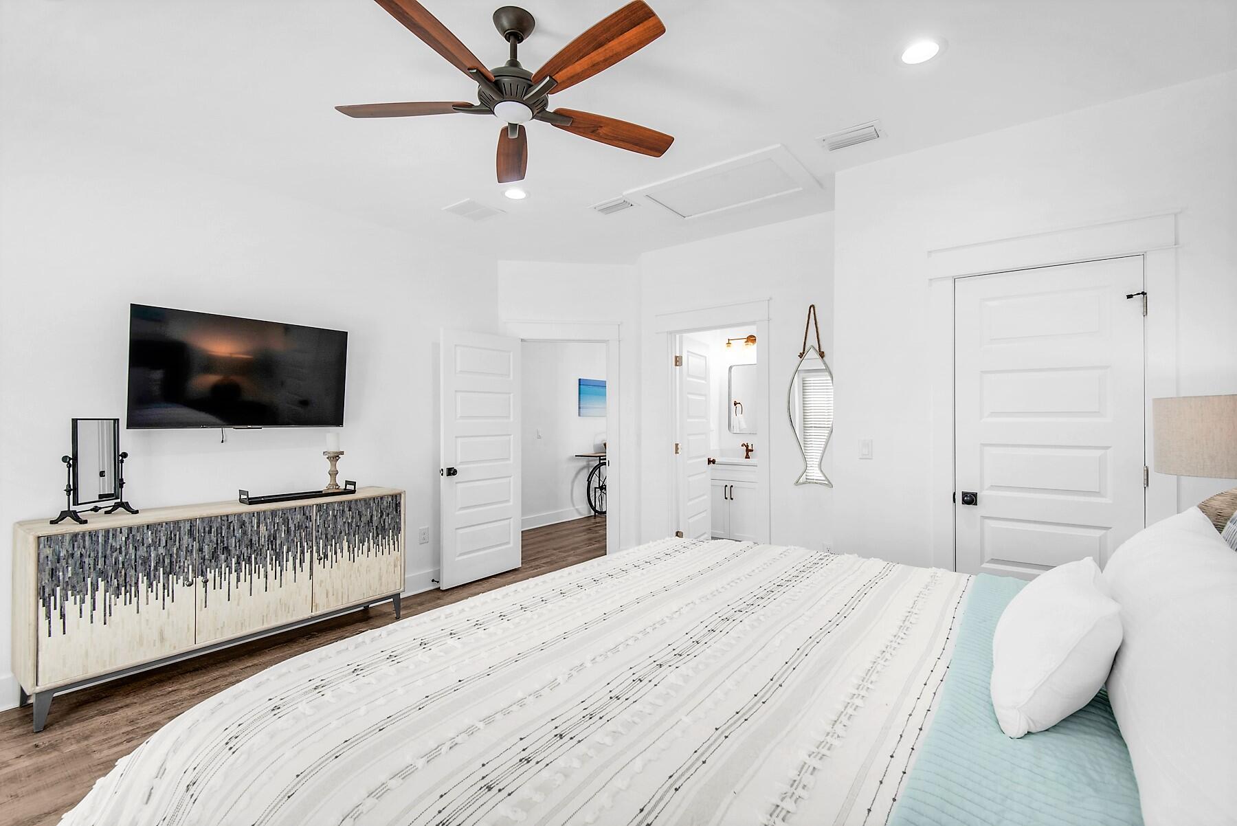 4541 Luke Avenue Destin, FL 32541 - Photo 37 of 49 a bedroom with a bed and a flat screen tv