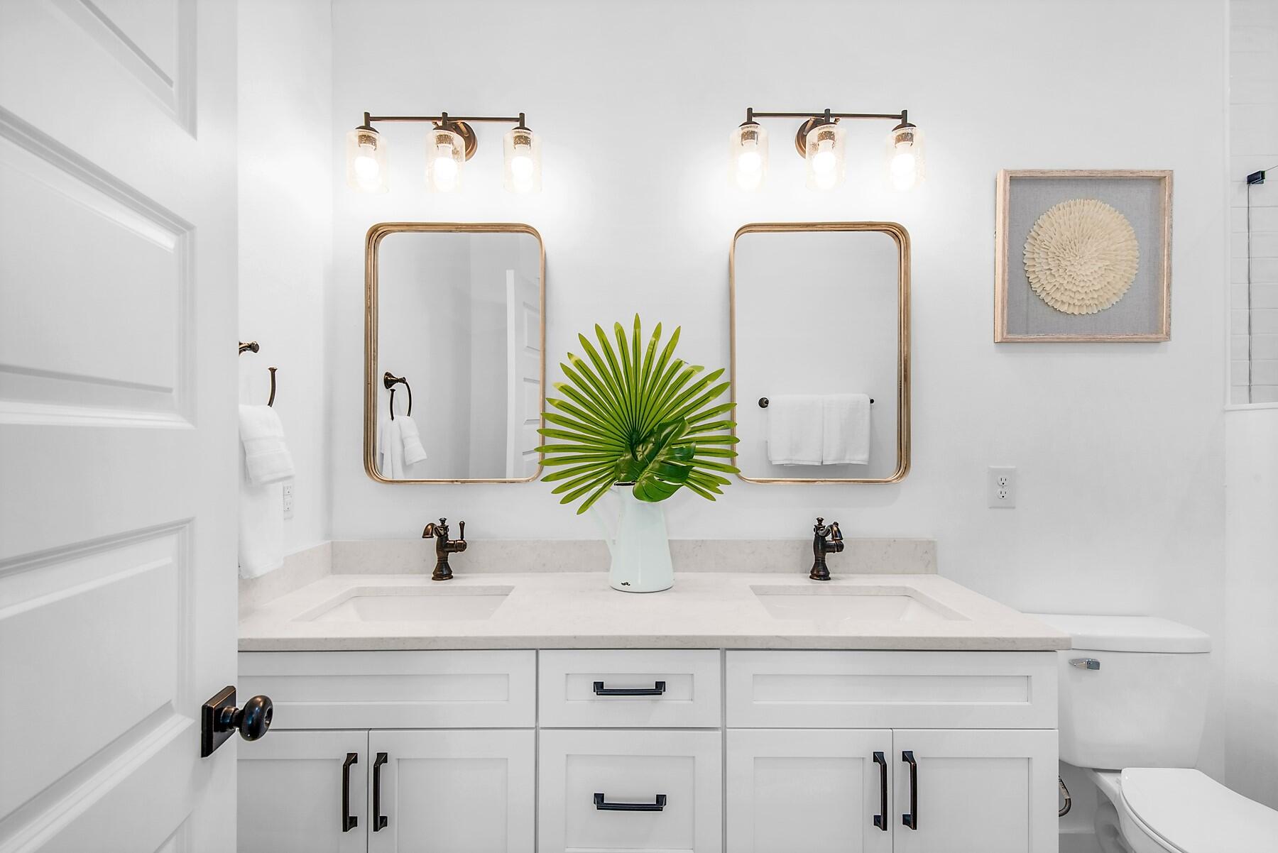 4541 Luke Avenue Destin, FL 32541 - Photo 38 of 49 a bathroom with double vanity sinks and a mirror