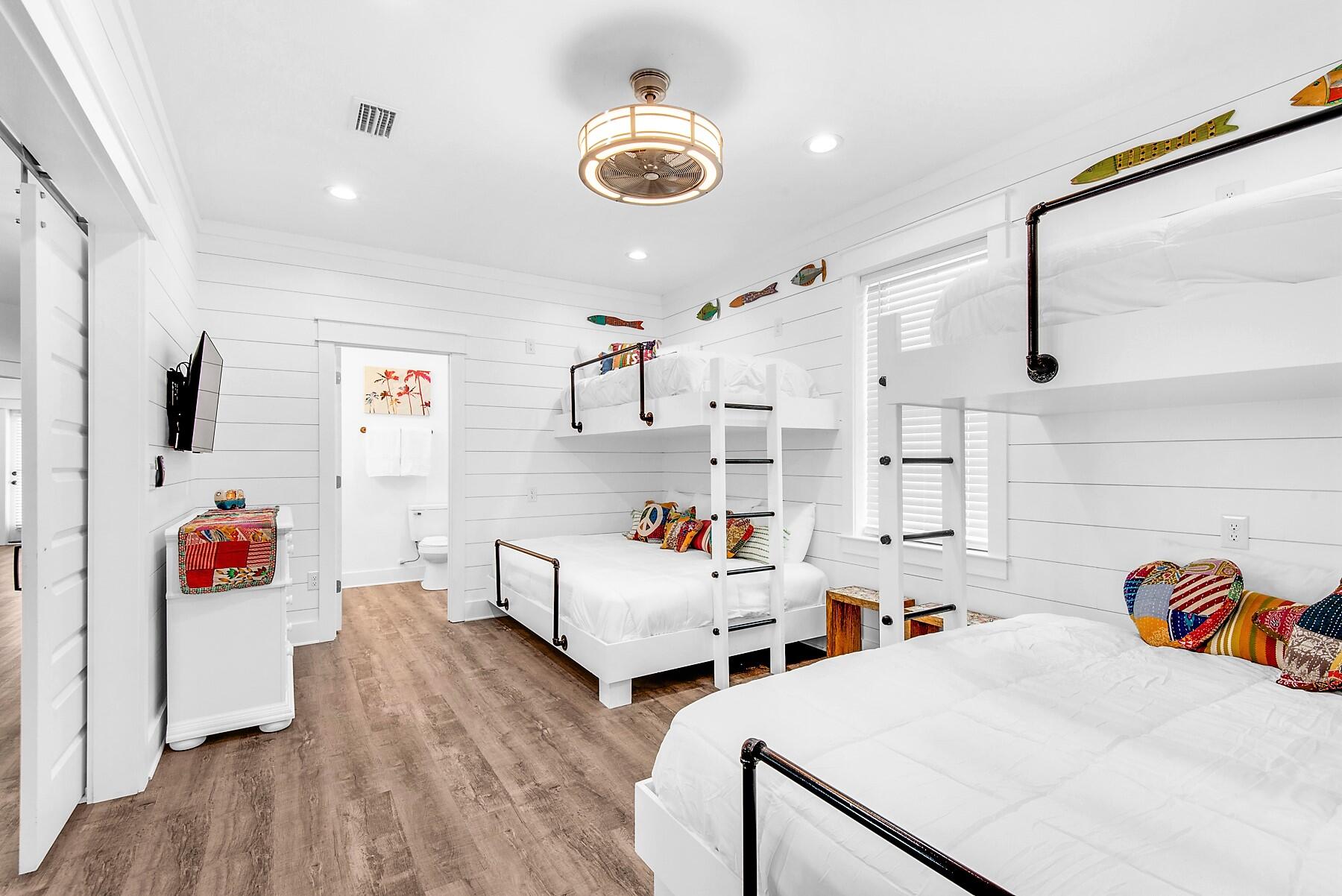 4541 Luke Avenue Destin, FL 32541 - Photo 41 of 49 a bedroom with furniture and wooden floor