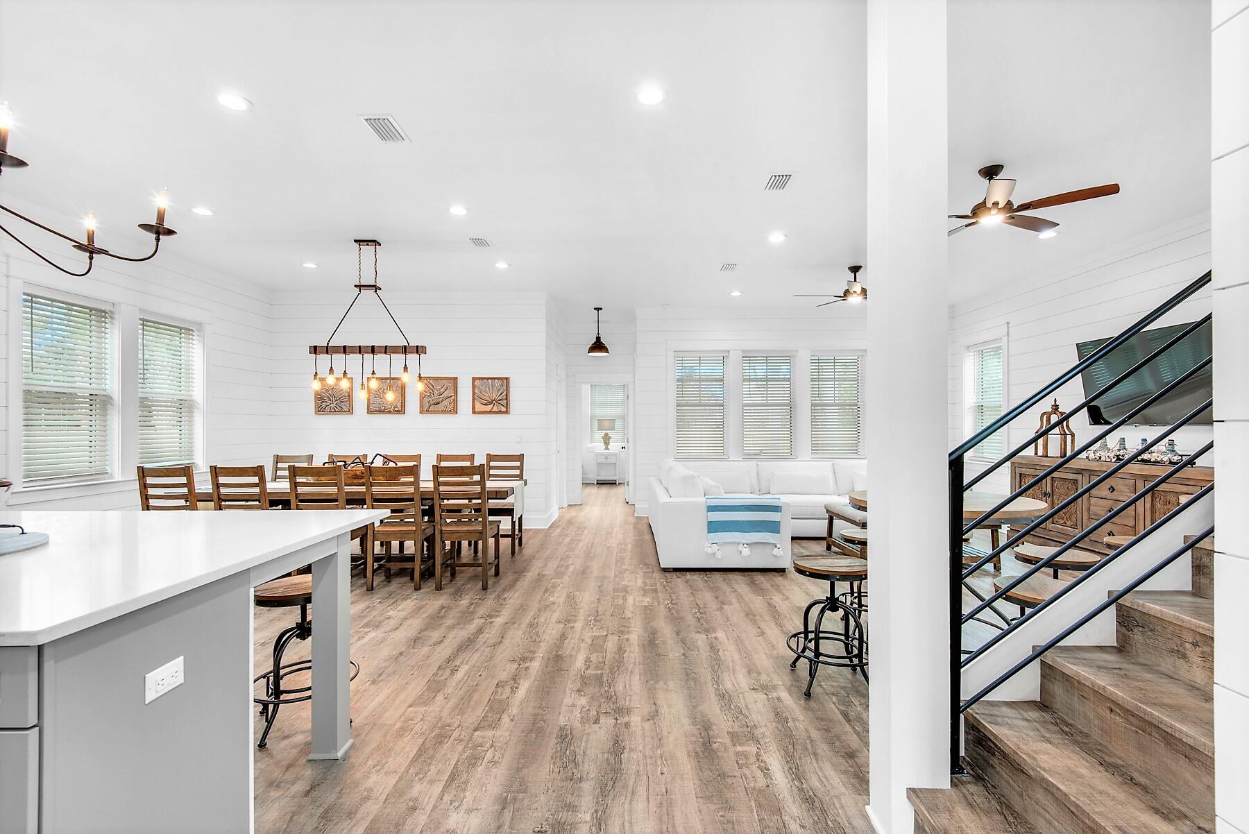 4541 Luke Avenue Destin, FL 32541 - Photo 7 of 49 an open kitchen with wooden floor and outdoor seating