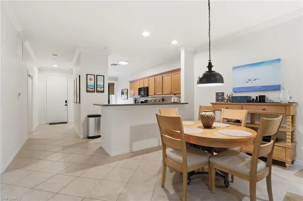 a dining room filled with furniture and window