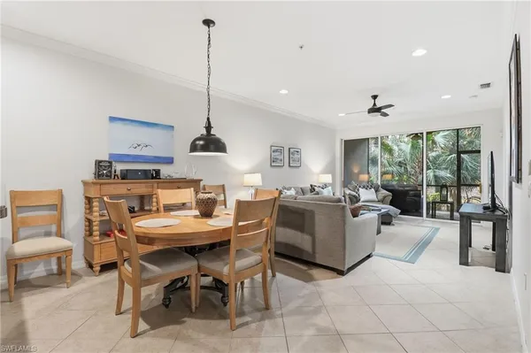 a living room with furniture tv and a large window