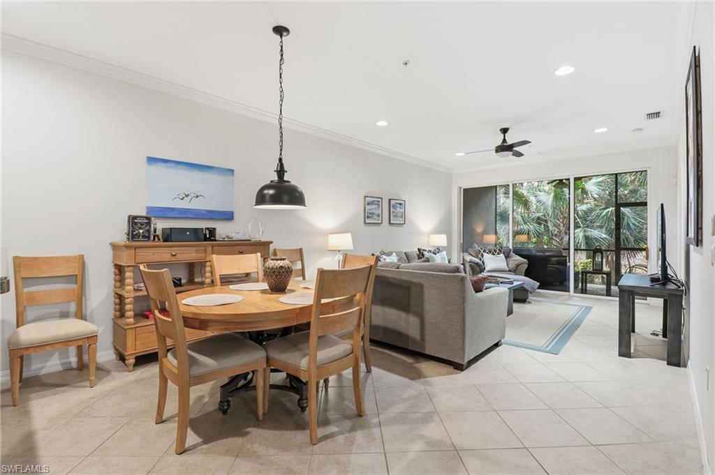 12040 Matera Lane, Unit 104 Bonita Springs, FL 34135 - Photo 22 of 36 Dining area with crown molding, light tile patterned flooring, ceiling fan, and recessed lighting