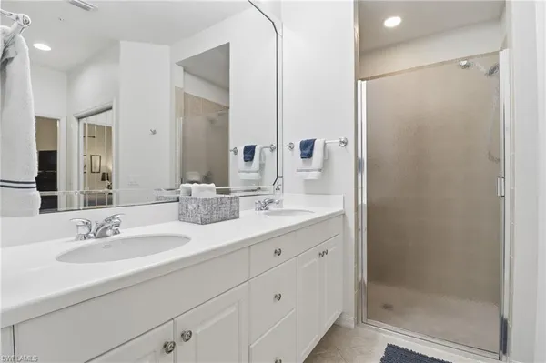 a bedroom with a bed and flat screen tv