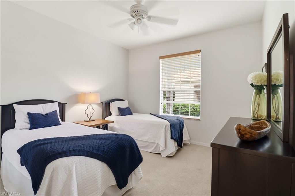 12040 Matera Lane, Unit 104 Bonita Springs, FL 34135 - Photo 33 of 36 a bedroom with a bed and a window
