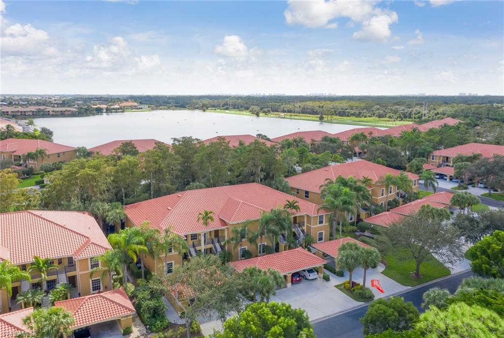 12040 Matera Lane, Unit 104 Bonita Springs, FL 34135 - Photo 7 of 36 an aerial view of lake and city