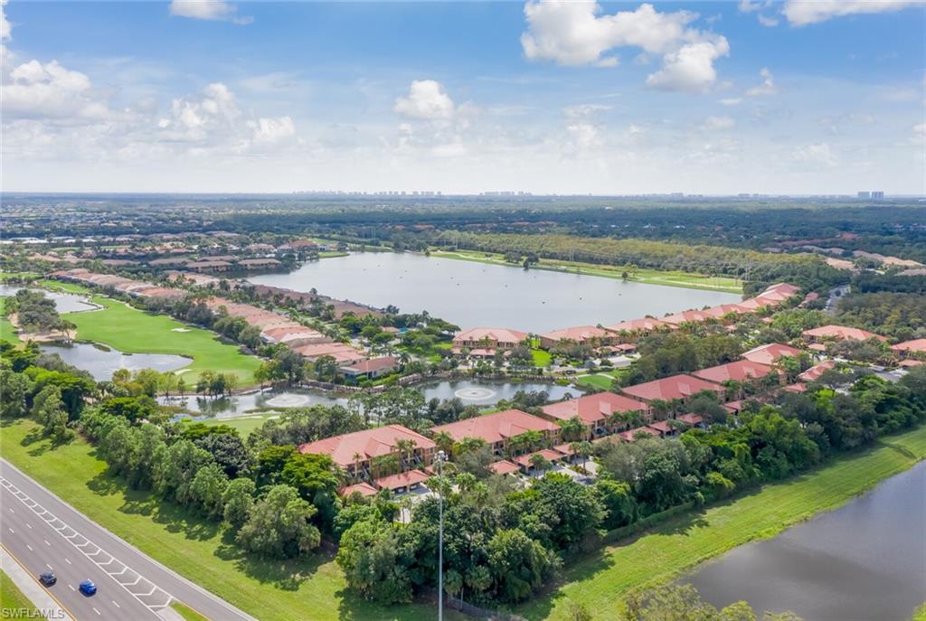 12040 Matera Lane, Unit 104 Bonita Springs, FL 34135 - Photo 8 of 36 a view of a lake with a city