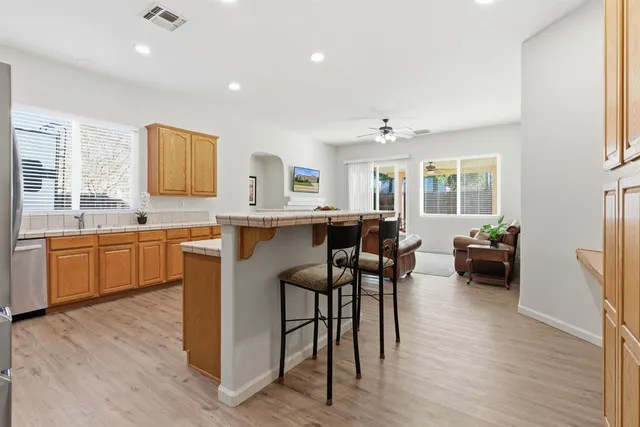a kitchen with a sink a counter top space and appliances