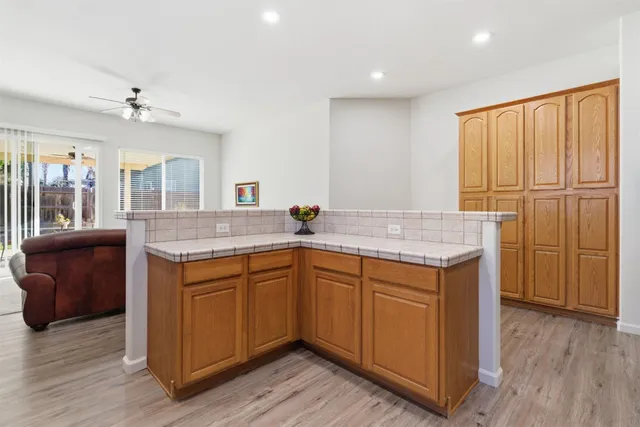 a kitchen with sink cabinets and wooden floor