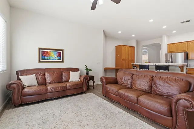 a view of a living room kitchen and a couch
