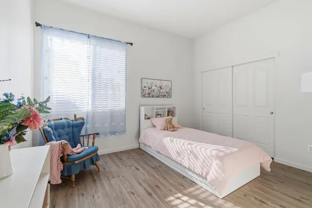 a bedroom with a bed and a couch