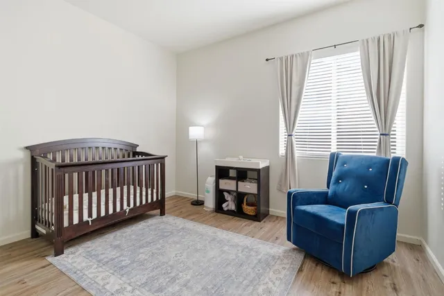 a bedroom with furniture and a window