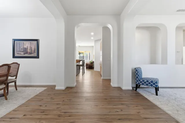 a view of a livingroom with furniture and wooden floor