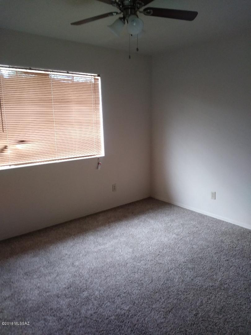 423 Teson Court Rio Rico, AZ 85648 - Photo 8 of 13 an empty room with a window