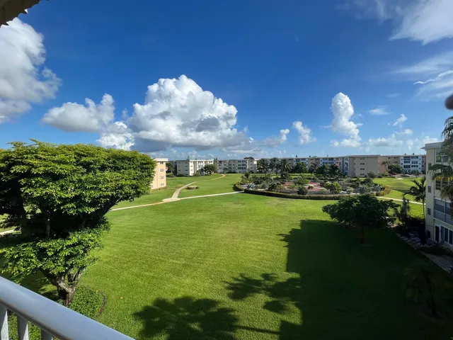 a view of street with parked cars