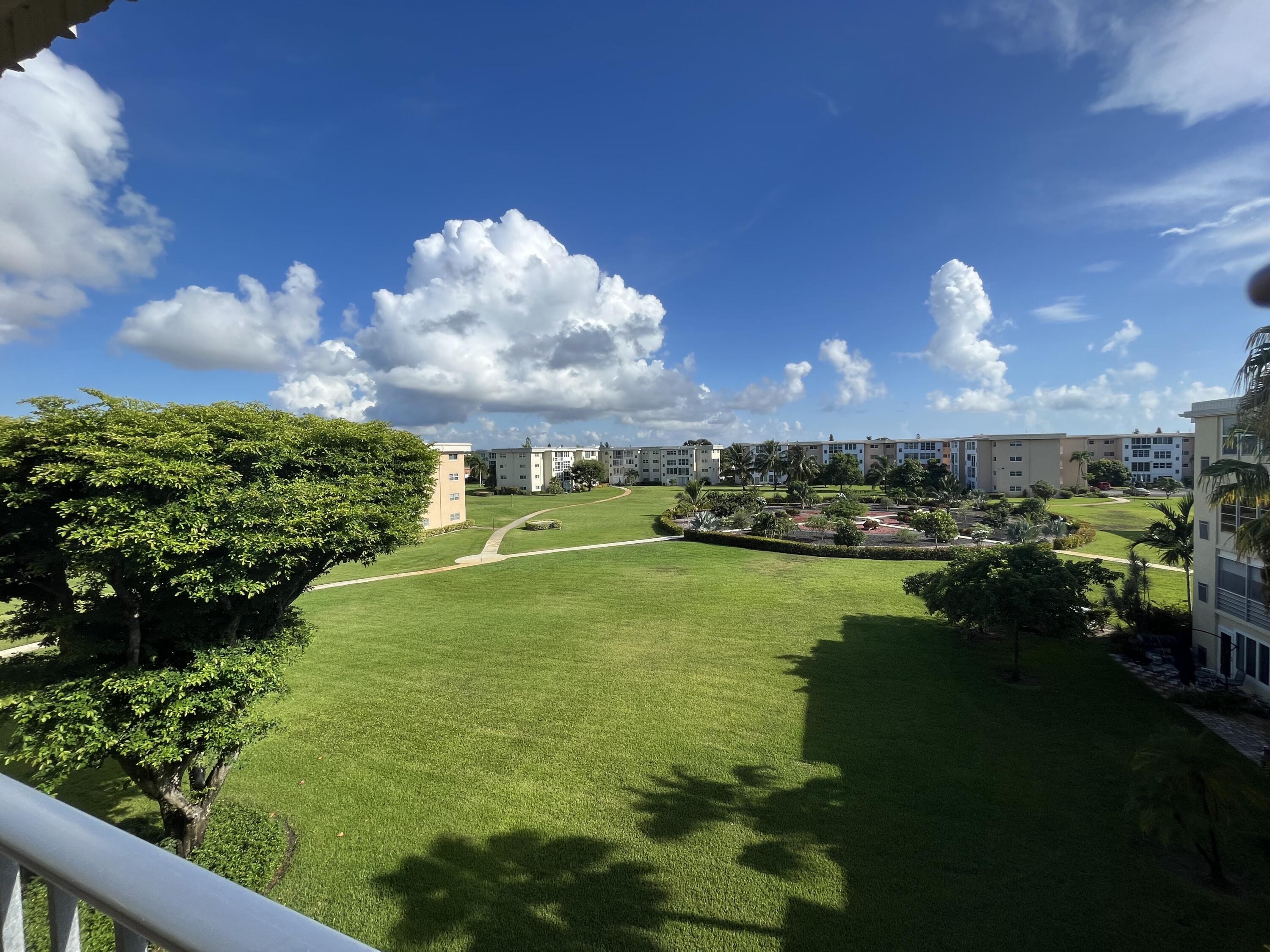 2515 Northeast 1st Court, Unit 411 Boynton Beach, FL 33435 - Photo 15 of 22 a view of a golf course with a swimming pool