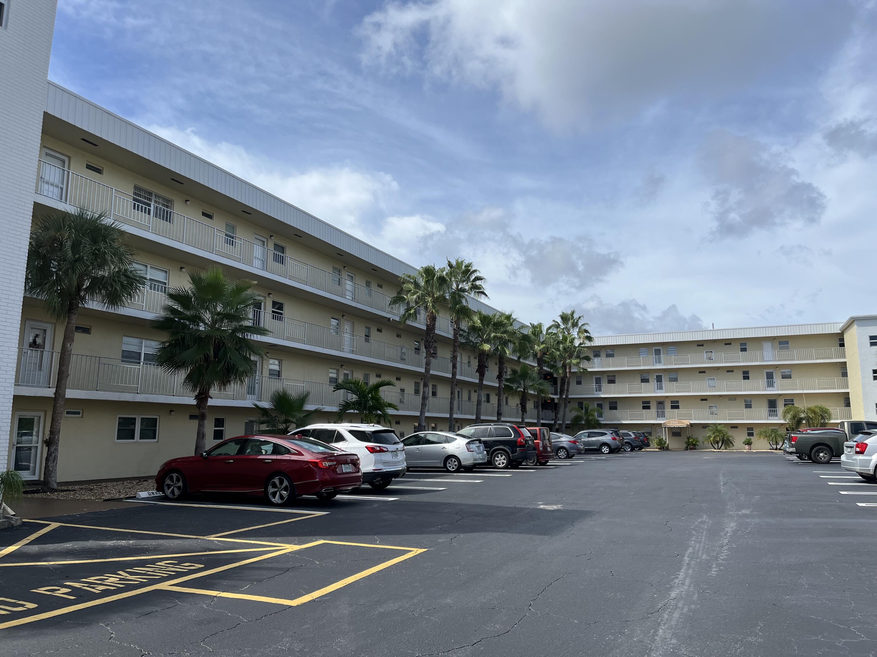 2515 Northeast 1st Court, Unit 411 Boynton Beach, FL 33435 - Photo 17 of 22 a view of street with parked cars