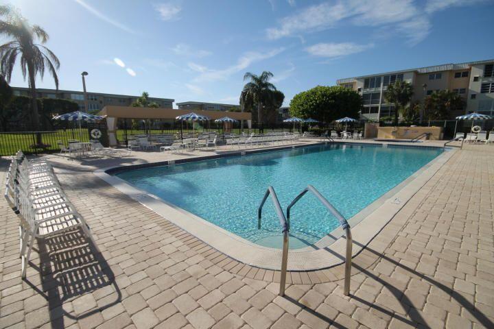 2515 Northeast 1st Court, Unit 411 Boynton Beach, FL 33435 - Photo 21 of 22 swimming pool view with a seating space