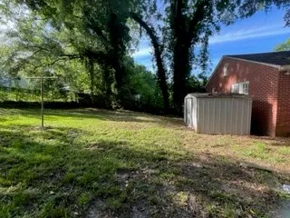 a view of a backyard with a small cabin