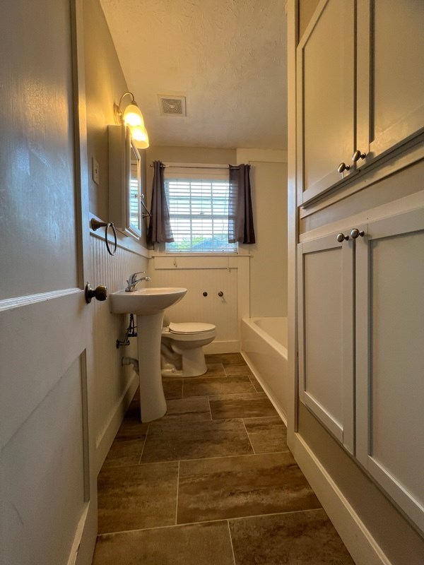 3401 17th Avenue Columbus, GA 31904 - Photo 24 of 26 a bathroom with a sink a toilet and mirror